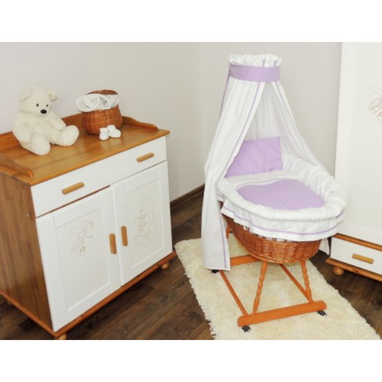 Wicker cot with purple set bedding