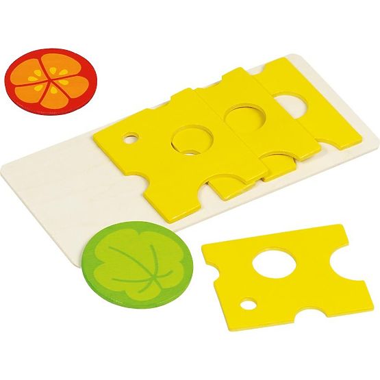 Cheese on the cutting board for children's kitchen