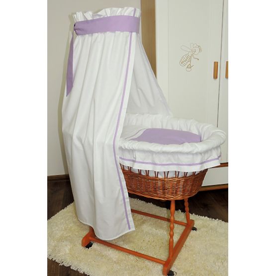 Wicker cot with purple set bedding