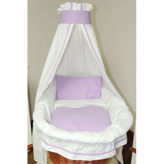 Wicker cot with purple set bedding