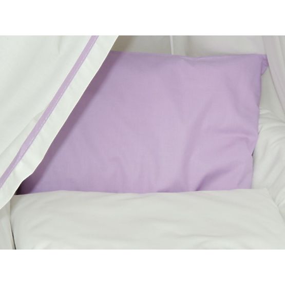 Wicker cot with purple set bedding