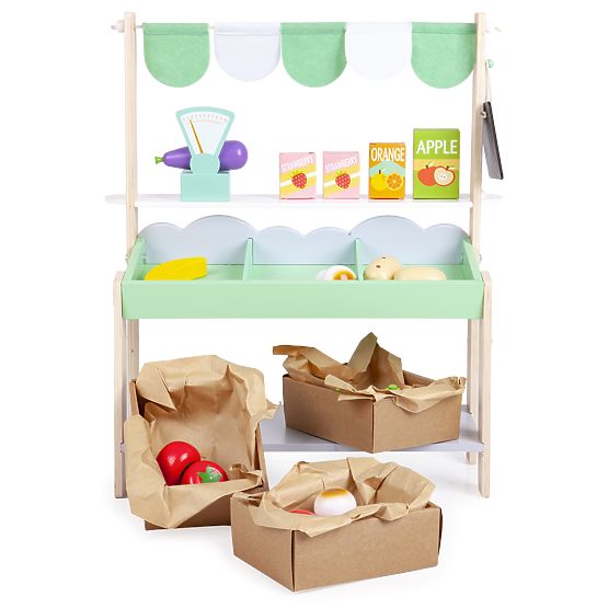 Wooden sales stand with vegetables