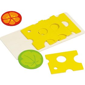 Cheese on the cutting board for children's kitchen